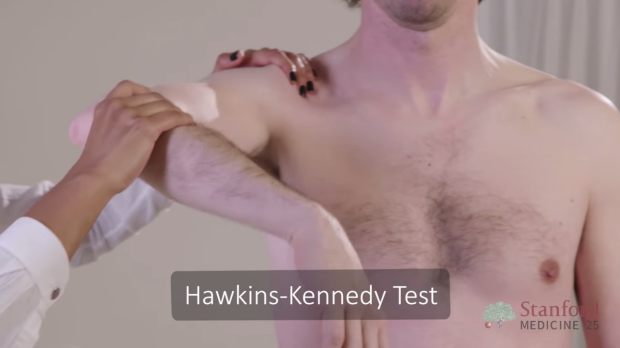 Doctor performing Hawkins-Kennedy Test on patient’s shoulder